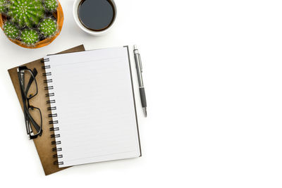 High angle view of coffee cup against white background