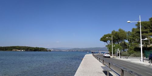 Scenic view of sea against clear blue sky