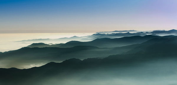 Scenic view of mountains against sky during sunset