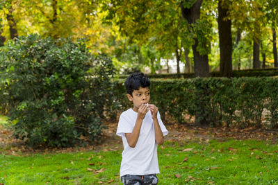 Young boy alone. having fun in a park.