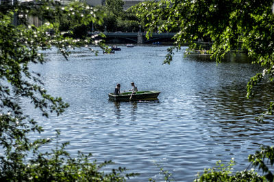 People in boat on river