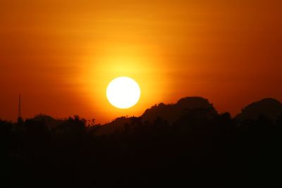 Scenic view of silhouette landscape against romantic sky at sunset