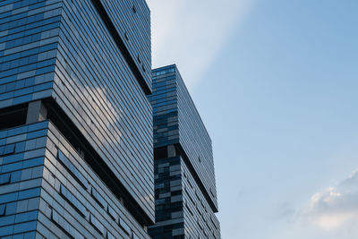 Low angle view of modern buildings against sky