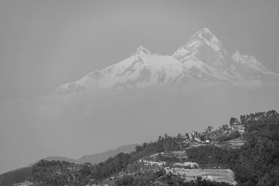 Scenic view of snowcapped mountains against sky