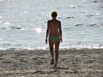 Woman standing on shore