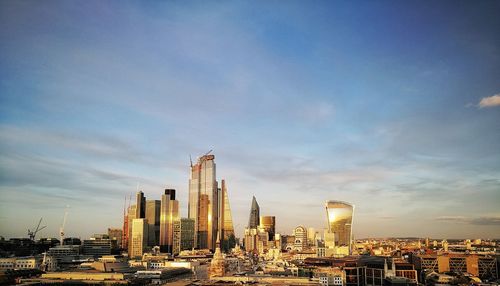 Modern buildings in city against sky