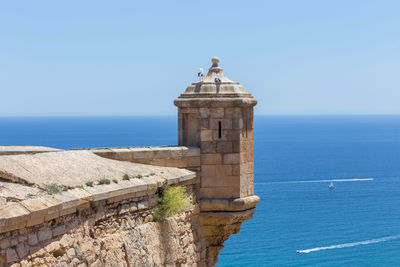 View of sea against clear blue sky