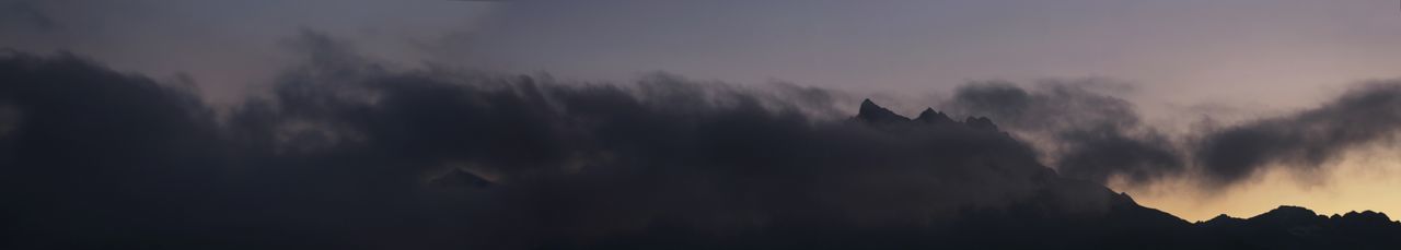 Low angle view of silhouette trees against sky at sunset