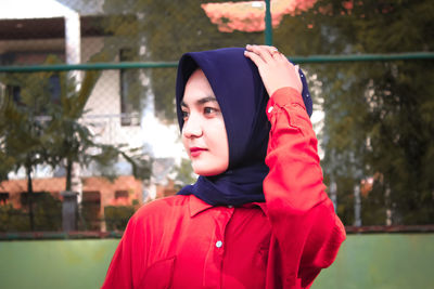 Portrait of a beautiful young woman looking away