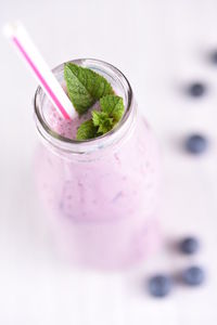 Close-up high angle view of smoothie in glass bottle on table