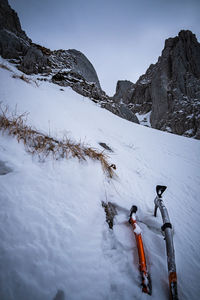 Scenic view of snow covered mountains against sky