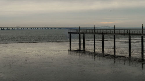 Pier on sea against sky