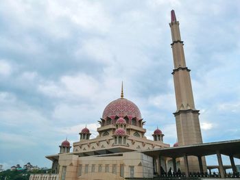 Landscape view of putra mosque against cloudy sky