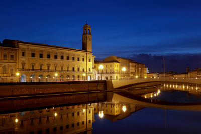 Reflection of illuminated buildings in water at night