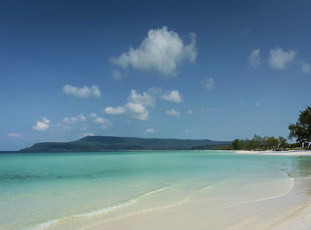 Scenic view of sea against blue sky