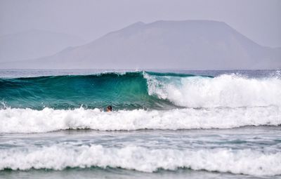 Man surfing in sea