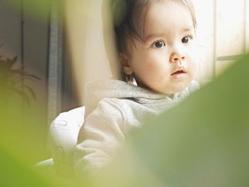 Portrait of cute baby girl at home