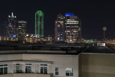 Buildings in city at night