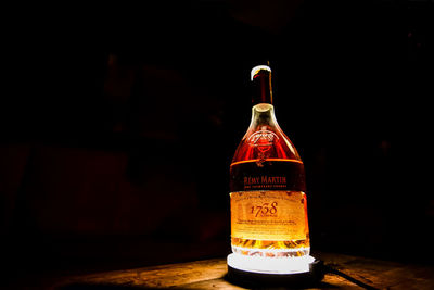 Glass of bottles on table