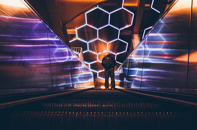 Illuminated escalator in tunnel