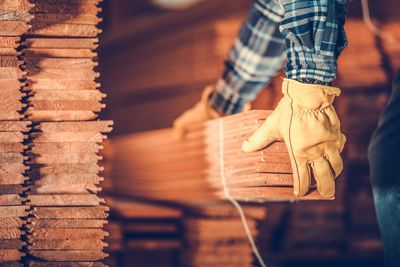 Close-up of man holding wood