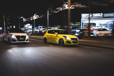 Car on city street at night