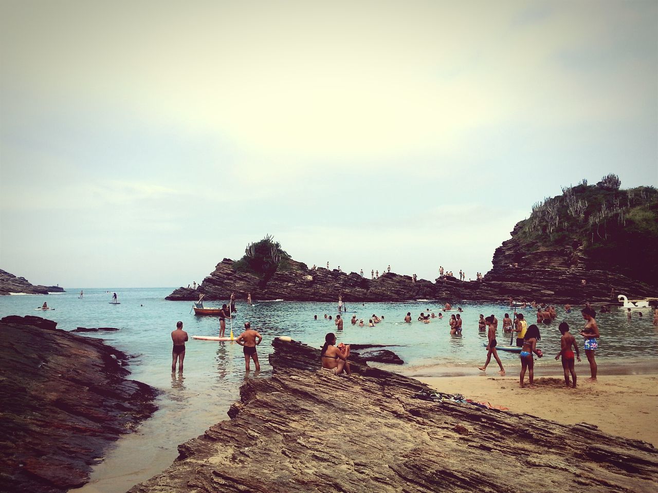 beach, sea, water, large group of people, shore, lifestyles, leisure activity, vacations, sky, person, sand, horizon over water, tourist, mixed age range, men, scenics, beauty in nature, tourism, tranquil scene