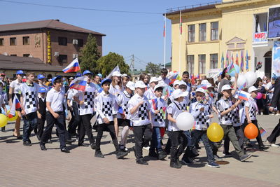 Group of people on street in city