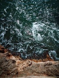 High angle view of rocks in sea
