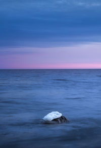 Scenic view of sea against sky at sunset