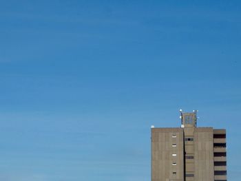 Low angle view of building against blue sky