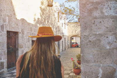 Tourist woman walking on vacation in street, arequipa, peru. selective focus