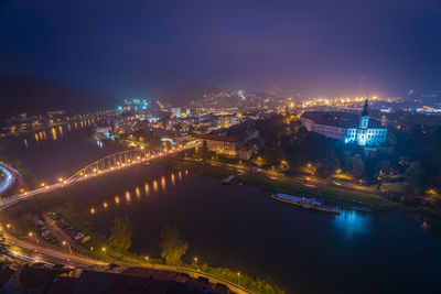 High angle view of illuminated buildings in city at night