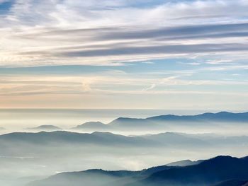 Scenic view of silhouette mountains against sky during sunset