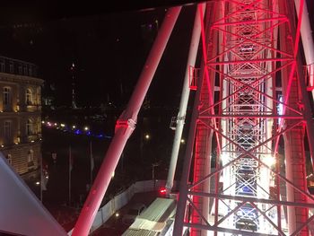 Low angle view of illuminated ferris wheel at night