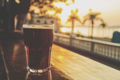 Close-up of beer glass on table