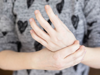 Close-up of hand holding hands