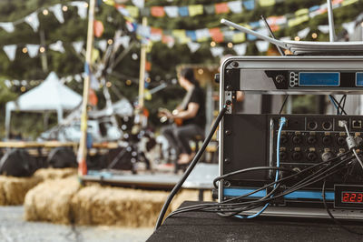 Close-up of electrical equipment on table outdoors