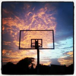 Low angle view of cloudy sky at sunset