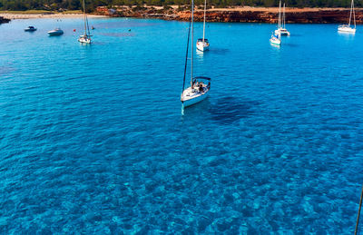 Sailboats sailing on sea at formentera del segura