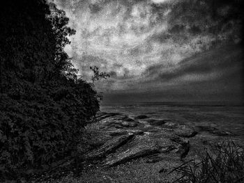 Scenic view of land against sky at dusk