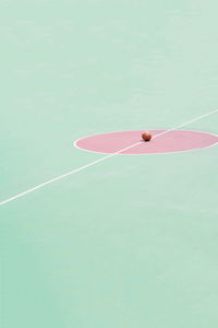 High angle view of basketball on court during sunny day