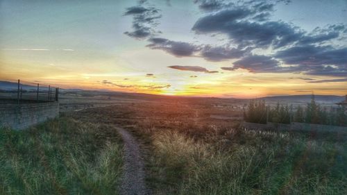 Scenic view of landscape at sunset