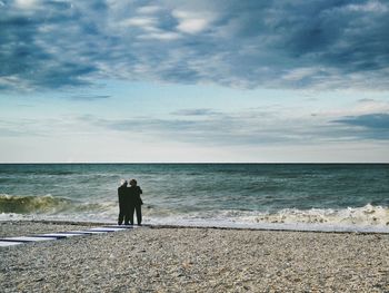 Scenic view of sea against cloudy sky