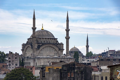 View of buildings in city against sky