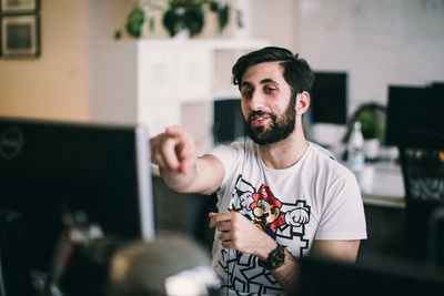 Young man standing at home