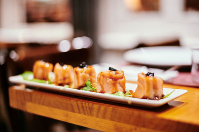 Close-up of sushi served on table