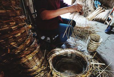 Low section of man working in basket