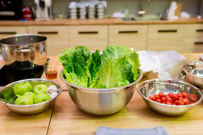 Raw foods and ingredients on the kitchen table before cooking