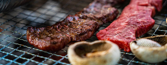 High angle view of meat on barbecue grill